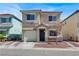 Charming two-story home with a well-maintained yard and inviting entrance, perfect for a Gathering at 5200 Paradise Skies Ave, Las Vegas, NV 89156