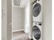 Convenient laundry area featuring stacked washer and dryer units, maximizing space and efficiency at 5200 Paradise Skies Ave, Las Vegas, NV 89156