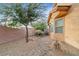 View of attractive backyard landscaping, a great look that minimizes water use at 6061 Moonlight Sonata Ave, Las Vegas, NV 89122