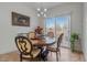 Cozy dining area with modern chandelier and stylish table set for an intimate meal at 6061 Moonlight Sonata Ave, Las Vegas, NV 89122
