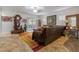 A spacious living room with large windows and sliding door leading to a covered patio at 6061 Moonlight Sonata Ave, Las Vegas, NV 89122
