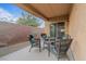 Inviting covered patio features stylish wicker furniture and offers a relaxing outdoor space at 6061 Moonlight Sonata Ave, Las Vegas, NV 89122