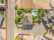 Aerial view of a home showcasing its pool, outdoor living space, and landscaping in a residential neighborhood at 6315 Bellisima St, Las Vegas, NV 89118