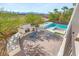Stunning backyard oasis with a pool, spa, outdoor kitchen, fireplace, and mountain views at 6315 Bellisima St, Las Vegas, NV 89118