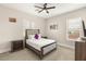 Cozy bedroom with a comfortable bed, neutral decor, and a ceiling fan at 6315 Bellisima St, Las Vegas, NV 89118