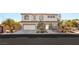 Stunning two-story home with a three car garage and desert landscaping at 6315 Bellisima St, Las Vegas, NV 89118