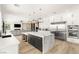 Open-concept kitchen featuring a center island with seating and stainless steel appliances at 6315 Bellisima St, Las Vegas, NV 89118