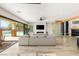 Spacious living area with modern fireplace, wine storage, and seamless access to the backyard at 6315 Bellisima St, Las Vegas, NV 89118