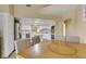 Open layout kitchen and dining area with white cabinetry and neutral colors at 7217 Mission Hills Dr, Las Vegas, NV 89113