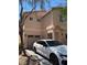 Exterior view showcasing a well-manicured lawn and a modern two-car garage and new sedan at 8355 Pearl Beach Ct, Las Vegas, NV 89139