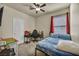 Comfortable bedroom with a ceiling fan, and a desk that creates a great workspace at 8421 Cheerful Brook Ave, Las Vegas, NV 89143