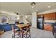 Well-lit kitchen features tile floors, wooden cabinets, a black refrigerator and appliances, and a dining table set at 8421 Cheerful Brook Ave, Las Vegas, NV 89143