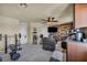 Multipurpose Living Room with wood accent wall and equipment for exercise at 8421 Cheerful Brook Ave, Las Vegas, NV 89143