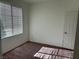 Cozy bedroom with neutral walls, plush carpet, and natural lighting at , Las Vegas, NV 89178