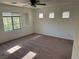 Spacious bedroom featuring neutral carpet, ample natural light, and contemporary ceiling fan at , Las Vegas, NV 89178