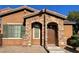Charming home entrance featuring a stone archway and warm, inviting tones at , Las Vegas, NV 89178
