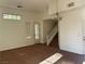 Bright living room with staircase and neutral carpet at , Las Vegas, NV 89178