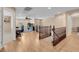 Open loft area with hardwood floors, a ceiling fan, and a dedicated office space with built-in shelves at 10135 Haymarket Peak Ave, Las Vegas, NV 89166