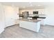 Bright, open kitchen featuring a large island, stainless steel appliances, and modern finishes throughout at 10442 Luna Mezza Ave # Lot 187, Las Vegas, NV 89141