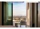 Balcony with city view, featuring outdoor seating and glass doors at 11660 Summit Club Dr # 204, Las Vegas, NV 89135