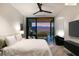 Cozy bedroom with a modern design, complemented by views of the golf course and surrounding mountains at 11660 Summit Club Dr # 204, Las Vegas, NV 89135