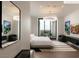 Stylish bedroom boasts modern chandelier, large windows, and contemporary furnishings at 11660 Summit Club Dr # 204, Las Vegas, NV 89135