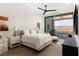 Bright bedroom with large sliding glass doors and access to an outdoor seating area with mountain views at 11660 Summit Club Dr # 204, Las Vegas, NV 89135