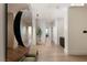 Elegant entryway featuring modern design, a large mirror, and hardwood floors at 11660 Summit Club Dr # 204, Las Vegas, NV 89135
