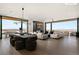 Open-concept living and dining area with panoramic views and stylish, contemporary furniture at 11660 Summit Club Dr # 204, Las Vegas, NV 89135