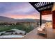 Enjoy outdoor seating overlooking the green and mountain range at sunset at 11660 Summit Club Dr # 204, Las Vegas, NV 89135
