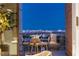 Relaxing patio area featuring comfortable seating and city views at 11660 Summit Club Dr # 204, Las Vegas, NV 89135