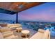 Relaxing patio area featuring comfortable seating and sunset views in this luxurious modern home at 11660 Summit Club Dr # 204, Las Vegas, NV 89135