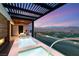 Stunning outdoor pool and patio area with mountain views in this luxurious modern home at 11660 Summit Club Dr # 204, Las Vegas, NV 89135