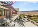 Expansive terrace with stylish seating and stunning views of the surrounding golf course and mountains at 11660 Summit Club Dr # 204, Las Vegas, NV 89135