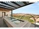 A luxurious terrace features a lap pool with views of the golf course and mountains at 11660 Summit Club Dr # 204, Las Vegas, NV 89135