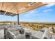A spacious terrace offers lounge seating and panoramic views of the city skyline and desert landscape at 11660 Summit Club Dr # 204, Las Vegas, NV 89135