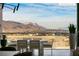 Outdoor dining area with picturesque views of the desert landscape and mountain range at 11660 Summit Club Dr # 204, Las Vegas, NV 89135