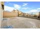 Spacious backyard featuring gravel and patio area, mountain views and privacy fence at 11676 Midnight Melody Ave, Las Vegas, NV 89138