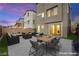 This backyard patio features modern outdoor seating and dining area, perfect for entertaining at 11676 Midnight Melody Ave, Las Vegas, NV 89138