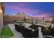 The backyard includes an outdoor seating area, perfect for entertaining, with mountain views at 11676 Midnight Melody Ave, Las Vegas, NV 89138