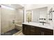 Elegant bathroom featuring a glass-enclosed shower and double sink vanity at 11676 Midnight Melody Ave, Las Vegas, NV 89138