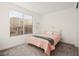 Bedroom featuring a pink bed, neutral walls, blinds, and carpeted floors at 11676 Midnight Melody Ave, Las Vegas, NV 89138