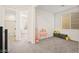 Neutral bedroom featuring carpet flooring, bright natural light, and decor at 11676 Midnight Melody Ave, Las Vegas, NV 89138