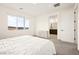 Bright bedroom with large window and view to the outside; adjacent bathroom is just steps away at 11676 Midnight Melody Ave, Las Vegas, NV 89138