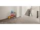 Bonus room featuring stairs, and carpet flooring at 11676 Midnight Melody Ave, Las Vegas, NV 89138