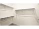 Walk-in closet with simple shelving at 11676 Midnight Melody Ave, Las Vegas, NV 89138