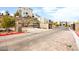 Gated community entrance, with stone accents and manicured landscaping, creates a secure and welcoming feel at 11676 Midnight Melody Ave, Las Vegas, NV 89138