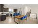 Spacious kitchen with stainless appliances, breakfast bar, and eat in dining area at 11676 Midnight Melody Ave, Las Vegas, NV 89138