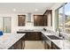 Gourmet kitchen features granite countertops, stainless steel appliances, and a view of the mountains at 11676 Midnight Melody Ave, Las Vegas, NV 89138
