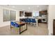 Modern kitchen and dining area with stainless appliances and ample counter space at 11676 Midnight Melody Ave, Las Vegas, NV 89138